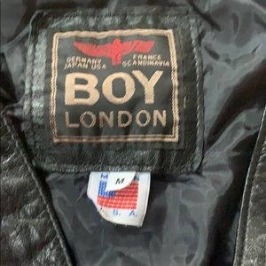 Leather shorts and vest . Boy London